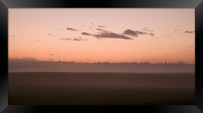 Misty fields at sunset Framed Print by Ian Middleton