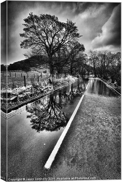 Reflections On The Road Canvas Print by Jason Connolly