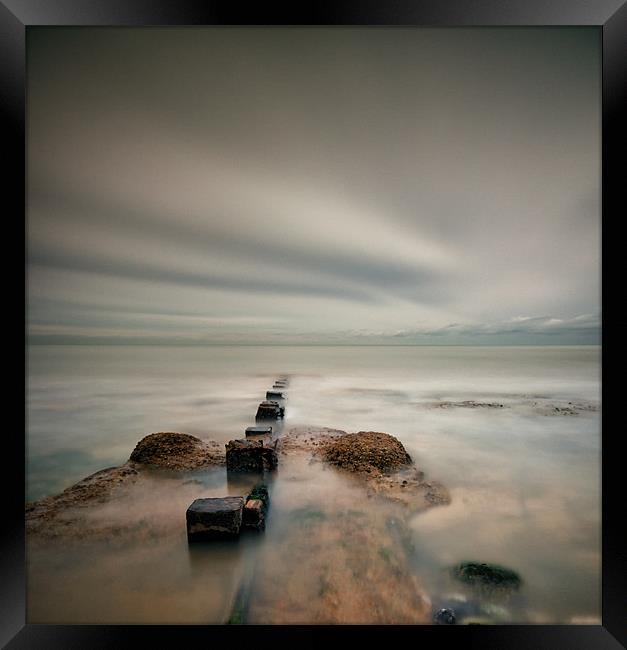 Posts into the Sea Framed Print by mark Worsfold