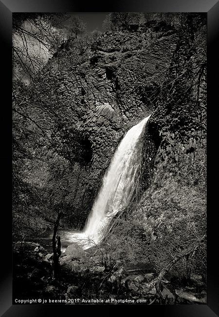 waterfall on volcanic cliff Framed Print by Jo Beerens