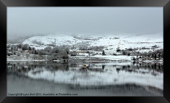 Snowy Reflections on the Loch Framed Print by Lynn Bolt