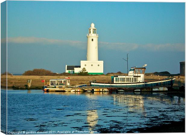Lighthouse at Hurst Point Canvas Print by Gordon Dimmer