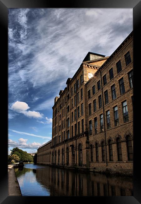 salts mill towering over leeds liverpool canal Framed Print by simon sugden