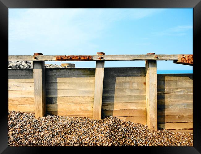 Sea defences with Martello Castle Framed Print by justin rafftree