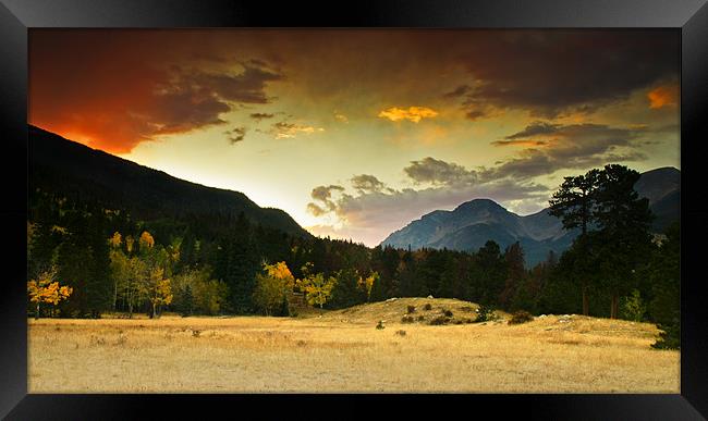 A Firey Autumn Sunset Framed Print by John De Bord