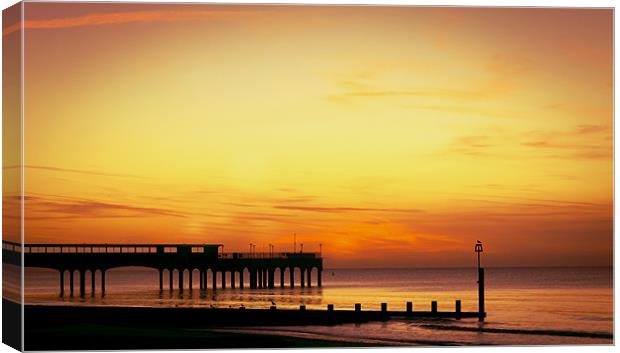 Sunrise over Pier Canvas Print by Jennie Franklin