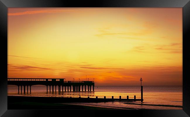 Sunrise over Pier Framed Print by Jennie Franklin