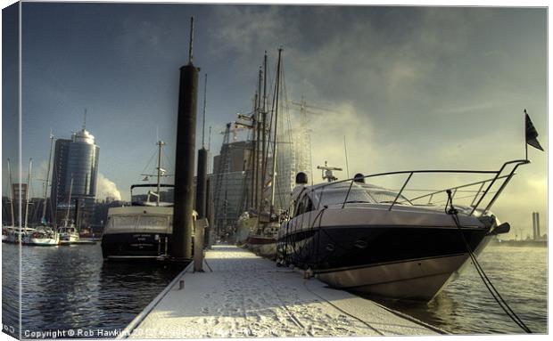 Yachts the city & snow Canvas Print by Rob Hawkins