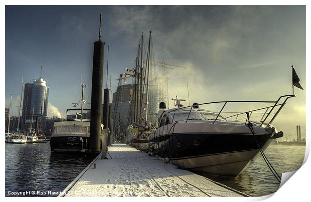 Yachts the city & snow Print by Rob Hawkins