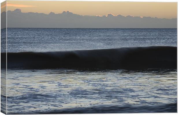 Waves crashing at dawn Canvas Print by Ian Middleton