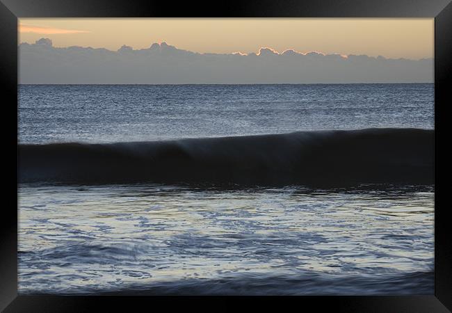 Waves crashing at dawn Framed Print by Ian Middleton