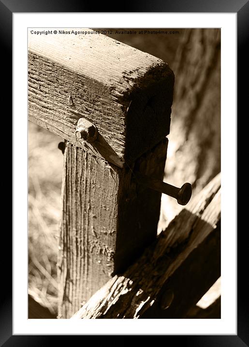 Metal bolts on timber posts Framed Mounted Print by Alfani Photography