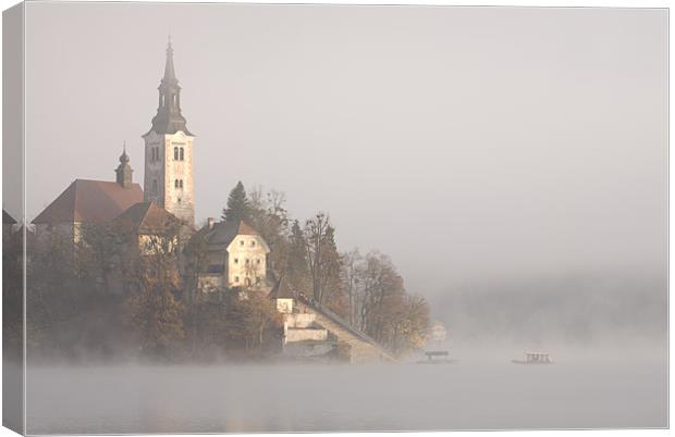 Misty Lake Bled Canvas Print by Ian Middleton