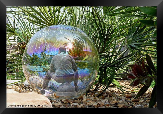 Man in a Glass Ball (composite) Framed Print by john hartley