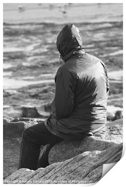 Lone Man Sitting on a Rocky Beach Print by Natalie Kinnear