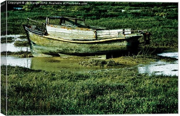 Old Boat Stranded in Mud Canvas Print by JG Mango