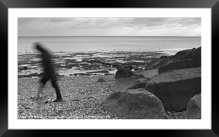 Lone Man Walking Along Pebble Beach Framed Mounted Print by Natalie Kinnear