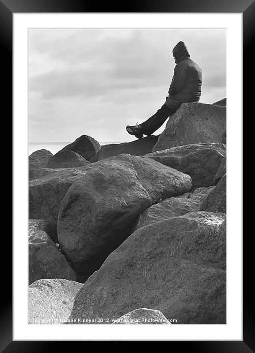 Lone Man Sitting on Rocky Beach Framed Mounted Print by Natalie Kinnear