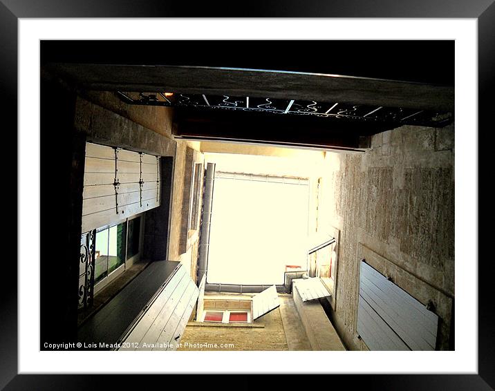 Looking up the Stairwell Framed Mounted Print by Lois Meads