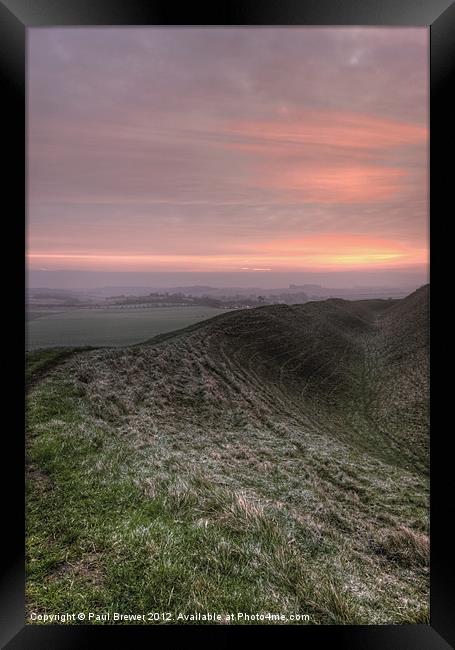 Sunrise over Maiden Castle Framed Print by Paul Brewer