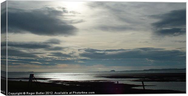 Holy Island Winter Skies Canvas Print by Roger Butler