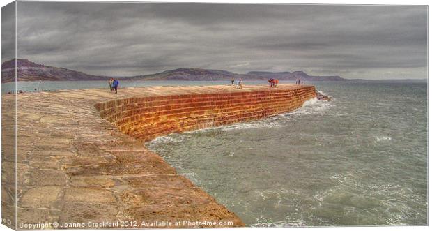 Stroll Along The Cobb Canvas Print by Joanne Crockford