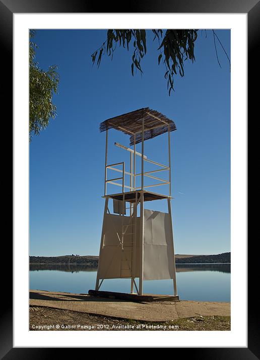 Lifeguard tower on beach Framed Mounted Print by Gabor Pozsgai