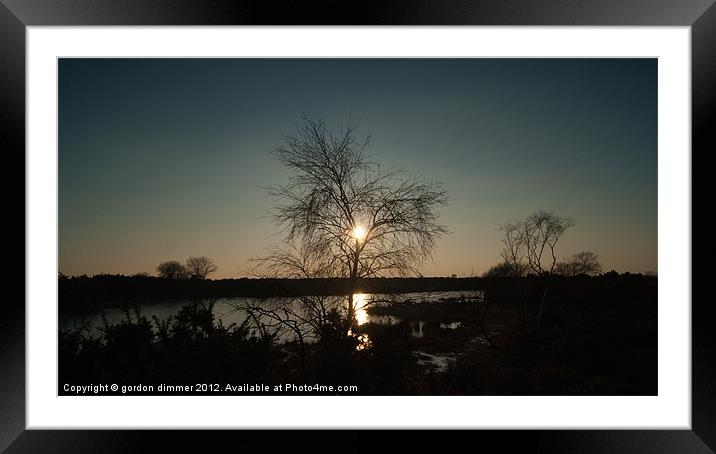 Reflections of a setting sun Framed Mounted Print by Gordon Dimmer