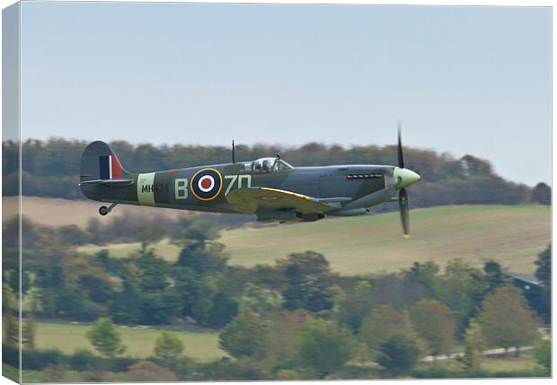 Low level Spitfire Canvas Print by Richard Thomas