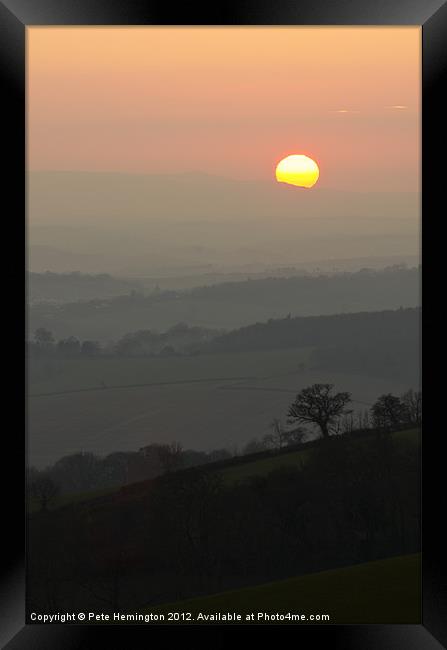 Sunset over the hills Framed Print by Pete Hemington