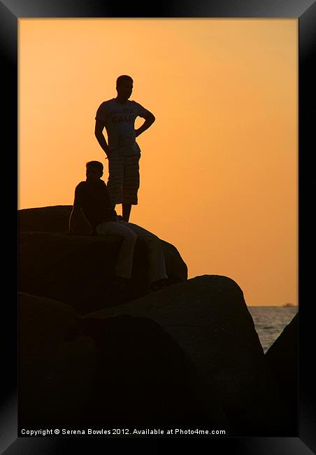 Silhouetted Figures on Rock at Sunset Palolem Framed Print by Serena Bowles