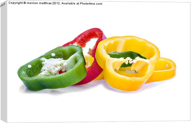colourful sliced peppers Canvas Print by meirion matthias