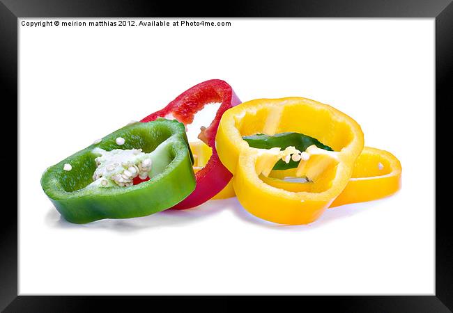 colourful sliced peppers Framed Print by meirion matthias