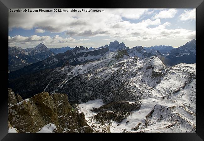 Mountain peaks and cloudy skies Framed Print by Steven Plowman