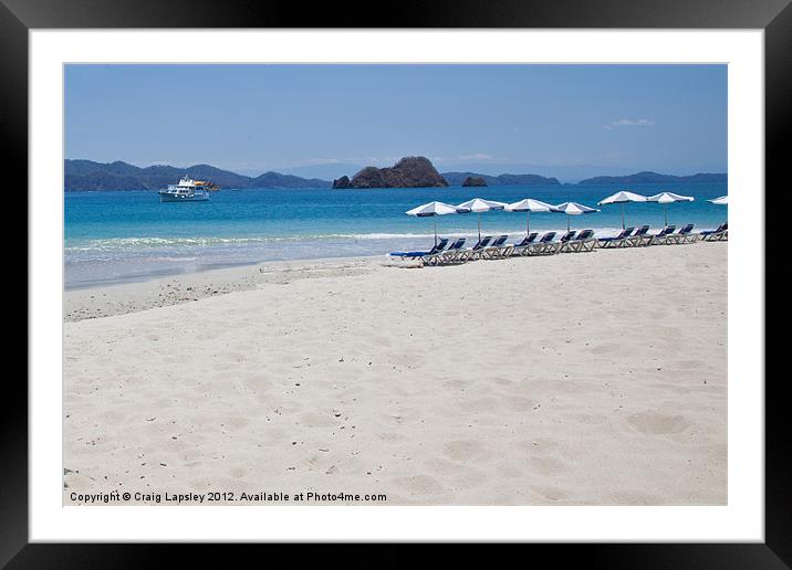 Deckchairs on a tropical beach Framed Mounted Print by Craig Lapsley