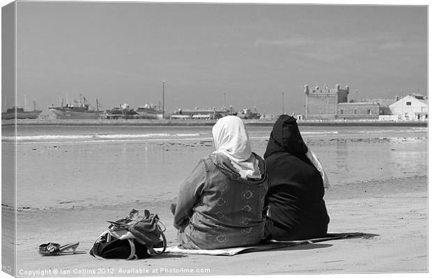 Moroccan women on beach Canvas Print by Ian Collins