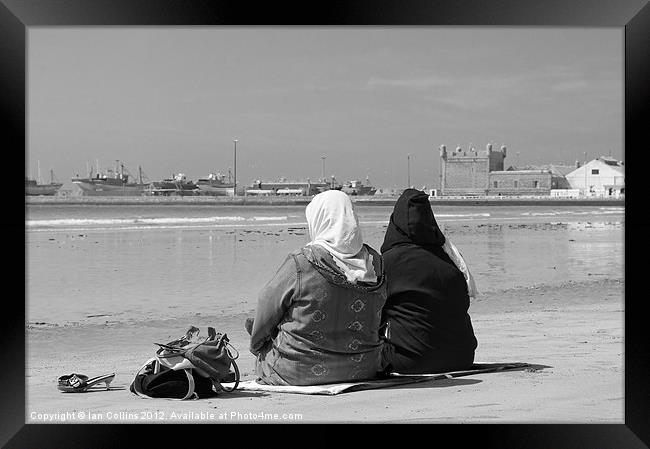 Moroccan women on beach Framed Print by Ian Collins