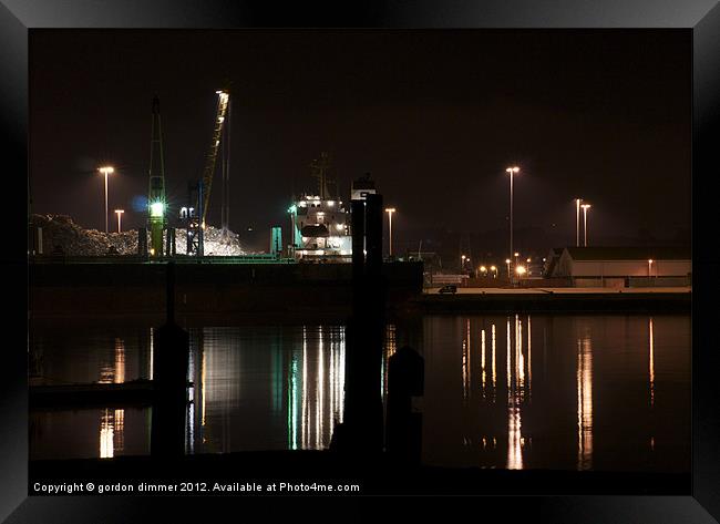 Working dockyard at night Framed Print by Gordon Dimmer
