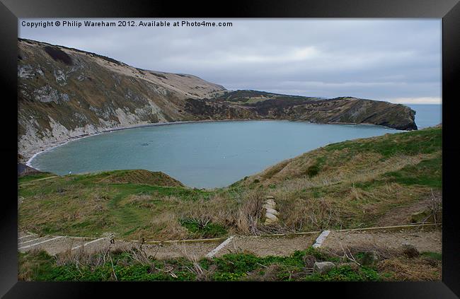 Lulworth Cove almost empty Framed Print by Phil Wareham