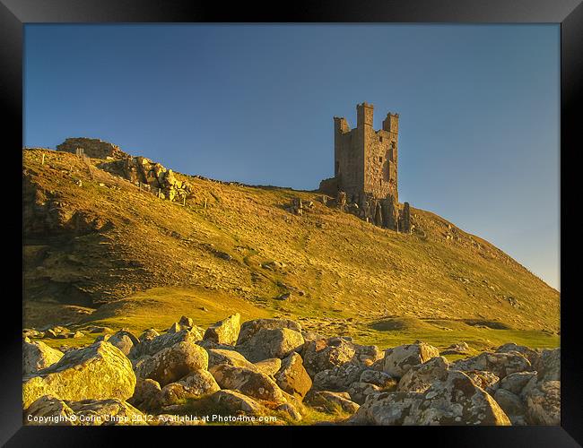 Dunstanburgh in the sun Framed Print by Colin Chipp