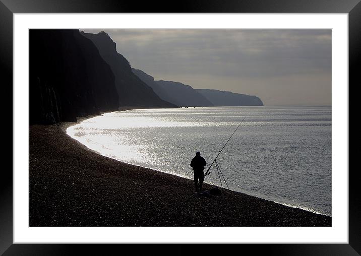 Fisherman angling on beach Framed Mounted Print by nick pautrat