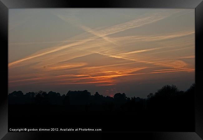 Contrails over New Forest Framed Print by Gordon Dimmer