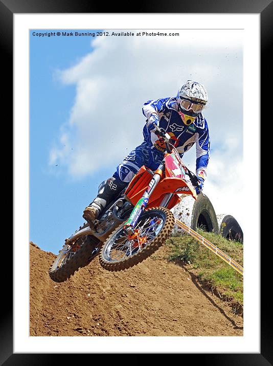 Motocross rider jumping Framed Mounted Print by Mark Bunning
