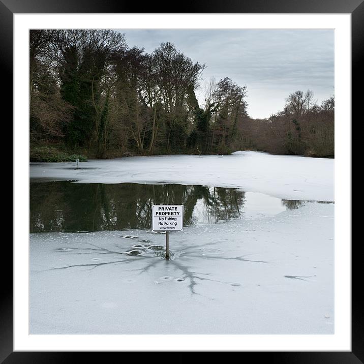 Frozen pond: no parking Framed Mounted Print by Gary Eason