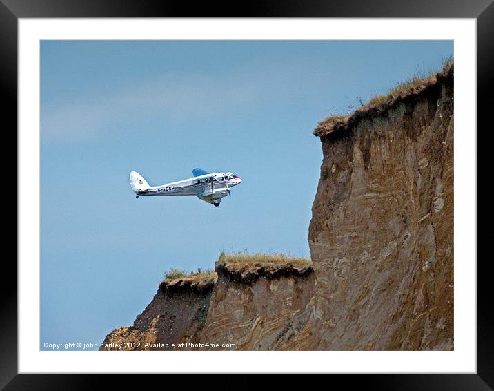 Vintage Dragon Rapide Aircraft over Weybourne Clif Framed Mounted Print by john hartley