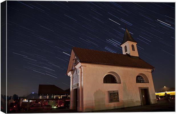 Star trails behind Vodice chapel Canvas Print by Ian Middleton