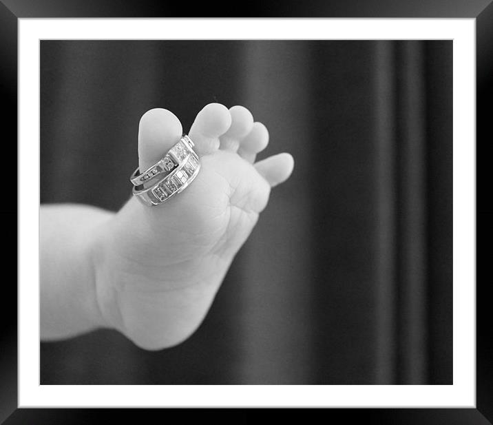 Babies foot with mummies rings Framed Mounted Print by Charlotte Anderson