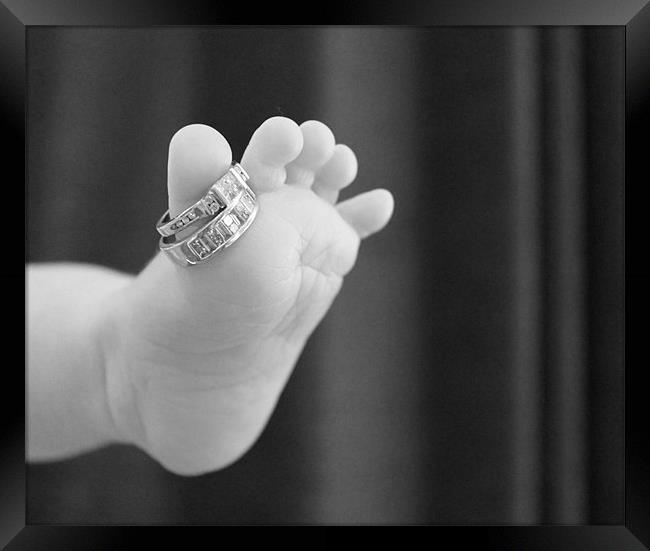 Babies foot with mummies rings Framed Print by Charlotte Anderson