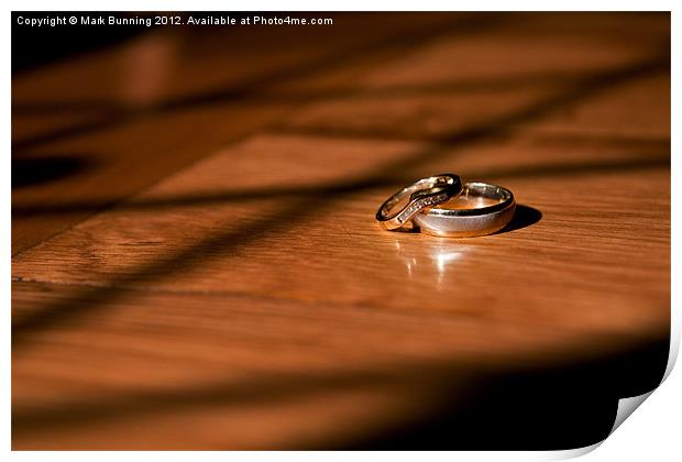 Wedding rings on a table Print by Mark Bunning