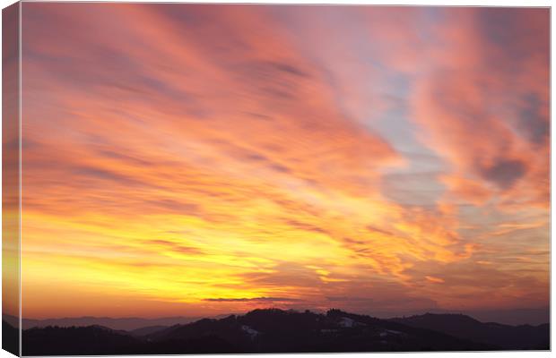 flaming sunset Canvas Print by Ian Middleton